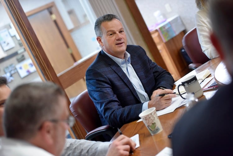 Photo of Kevin Gray during a staff meeting